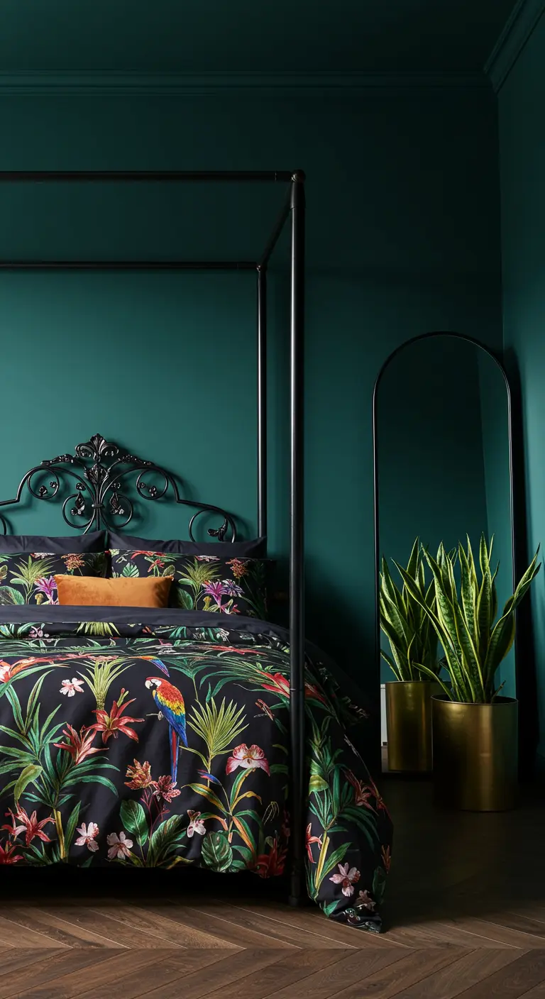 Dark teal bedroom with a black metal canopy bed and vibrant tropical print bedding.