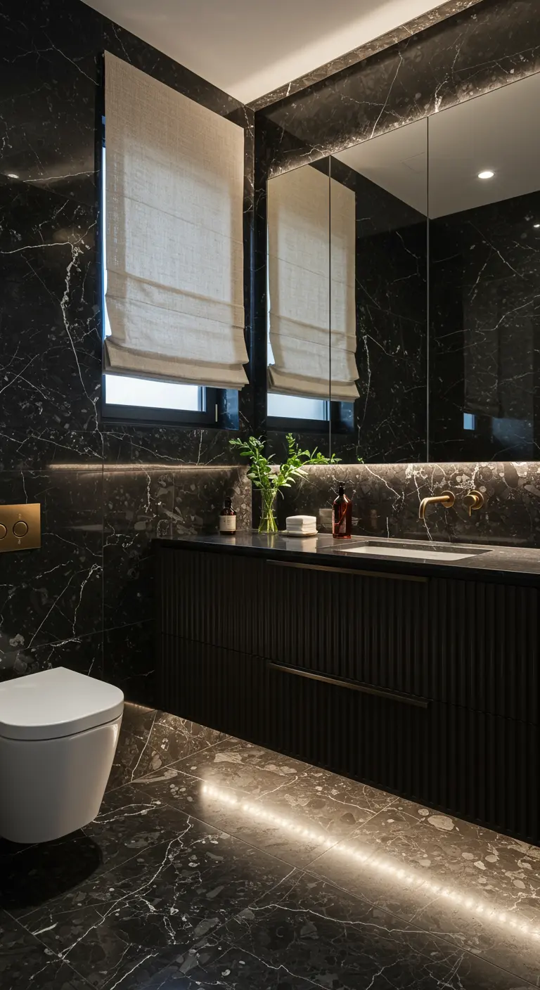 Black marble bathroom with a dark fluted wood vanity and linen Roman shades.