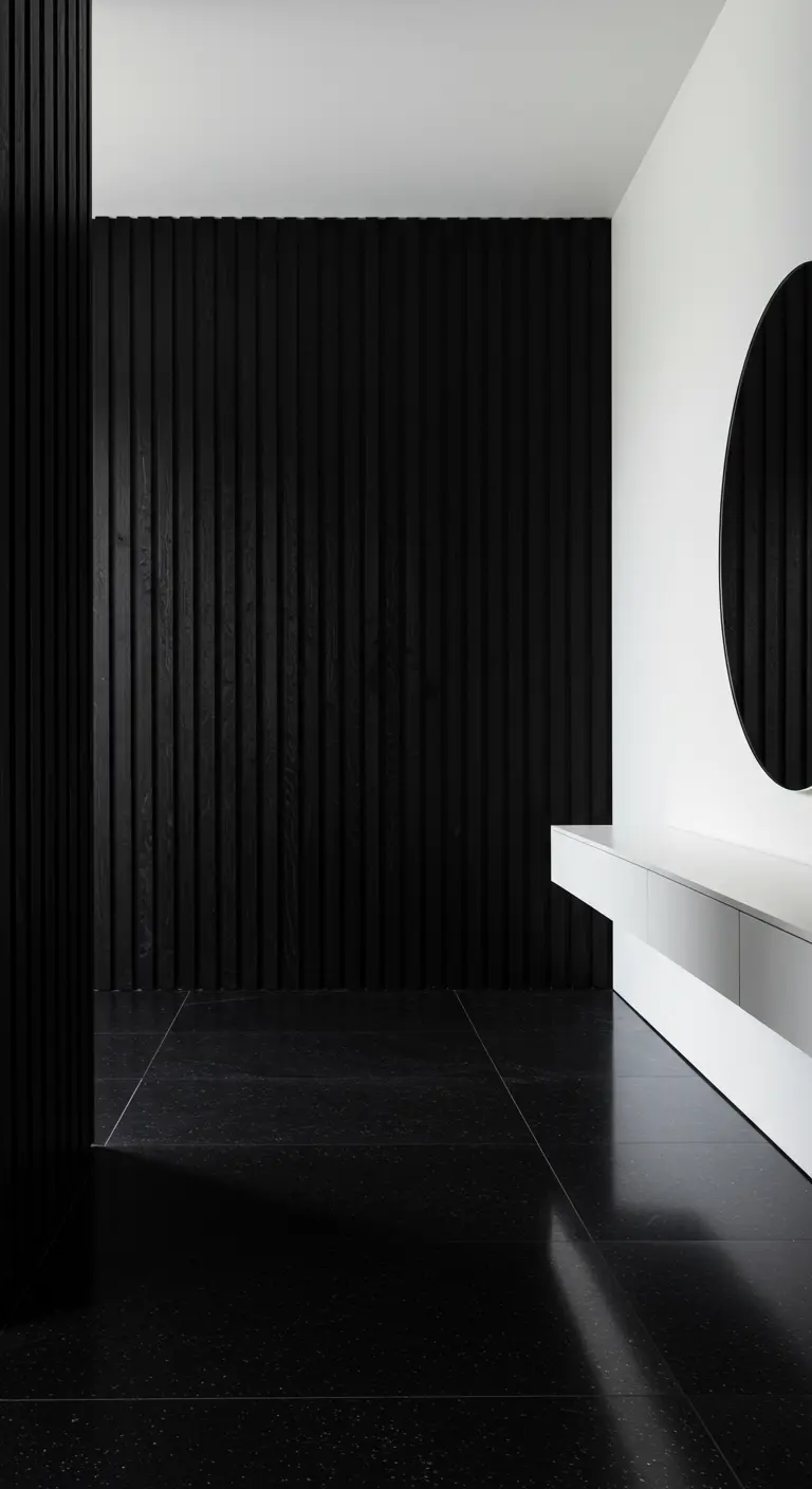 Entryway with a black vertical slatted wood wall and a large round mirror.