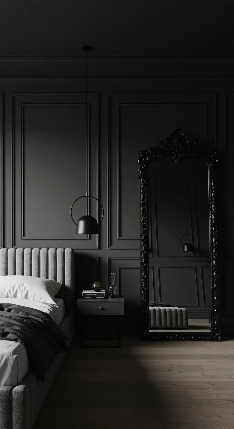 Dark gray bedroom with wall molding, a velvet headboard, and a large ornate black mirror.